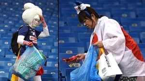 在被击退世界杯之后，日本球迷留在整洁的体育场