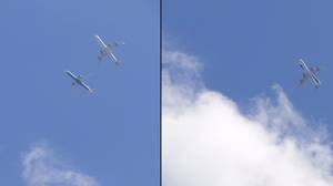 两架飞机被描绘的飞行可怕地彼此接近