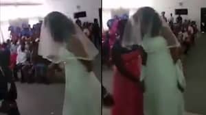 一名女子穿着新娘礼服闯入男友的婚礼